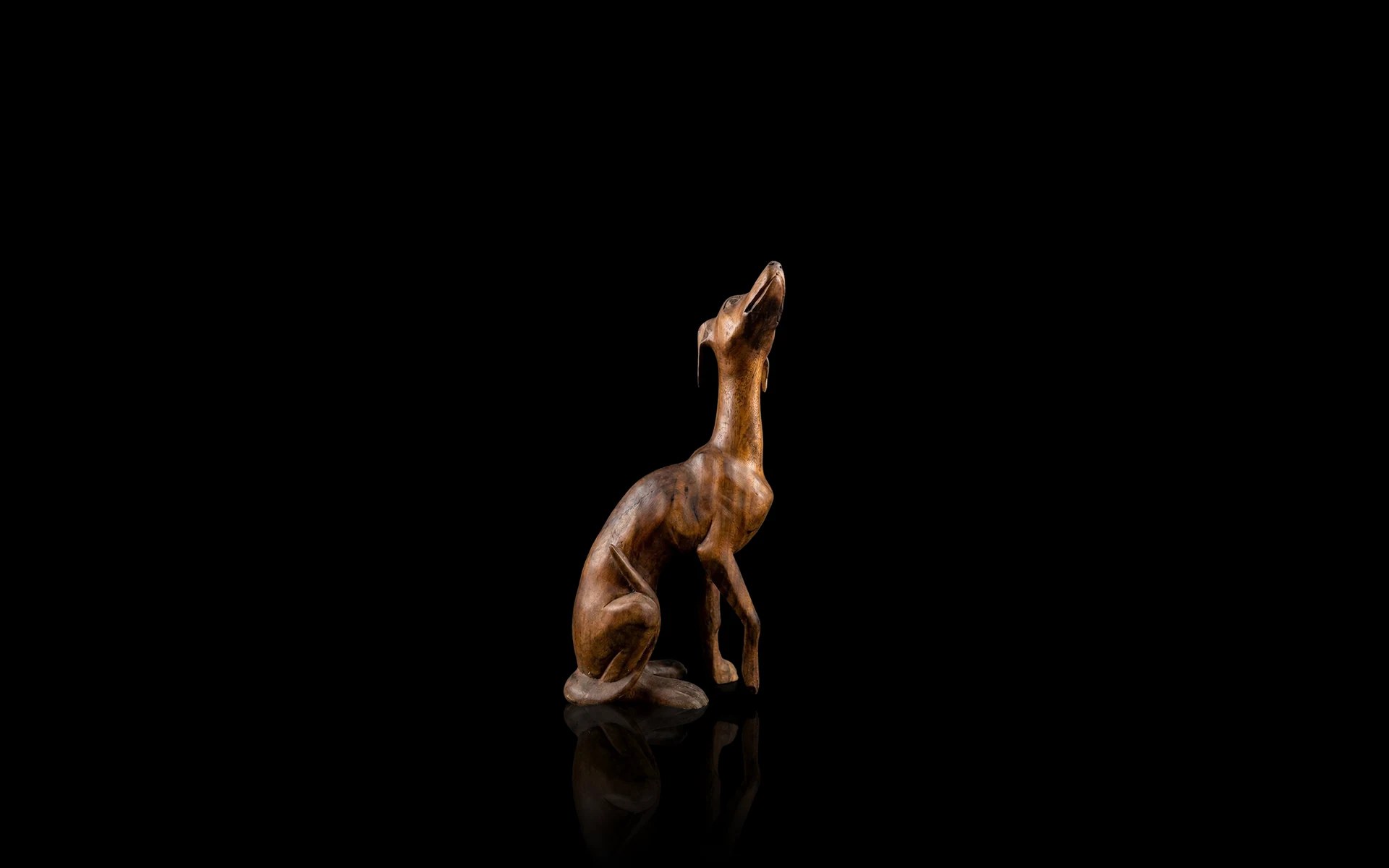 Hand-carved wooden dog sculpture