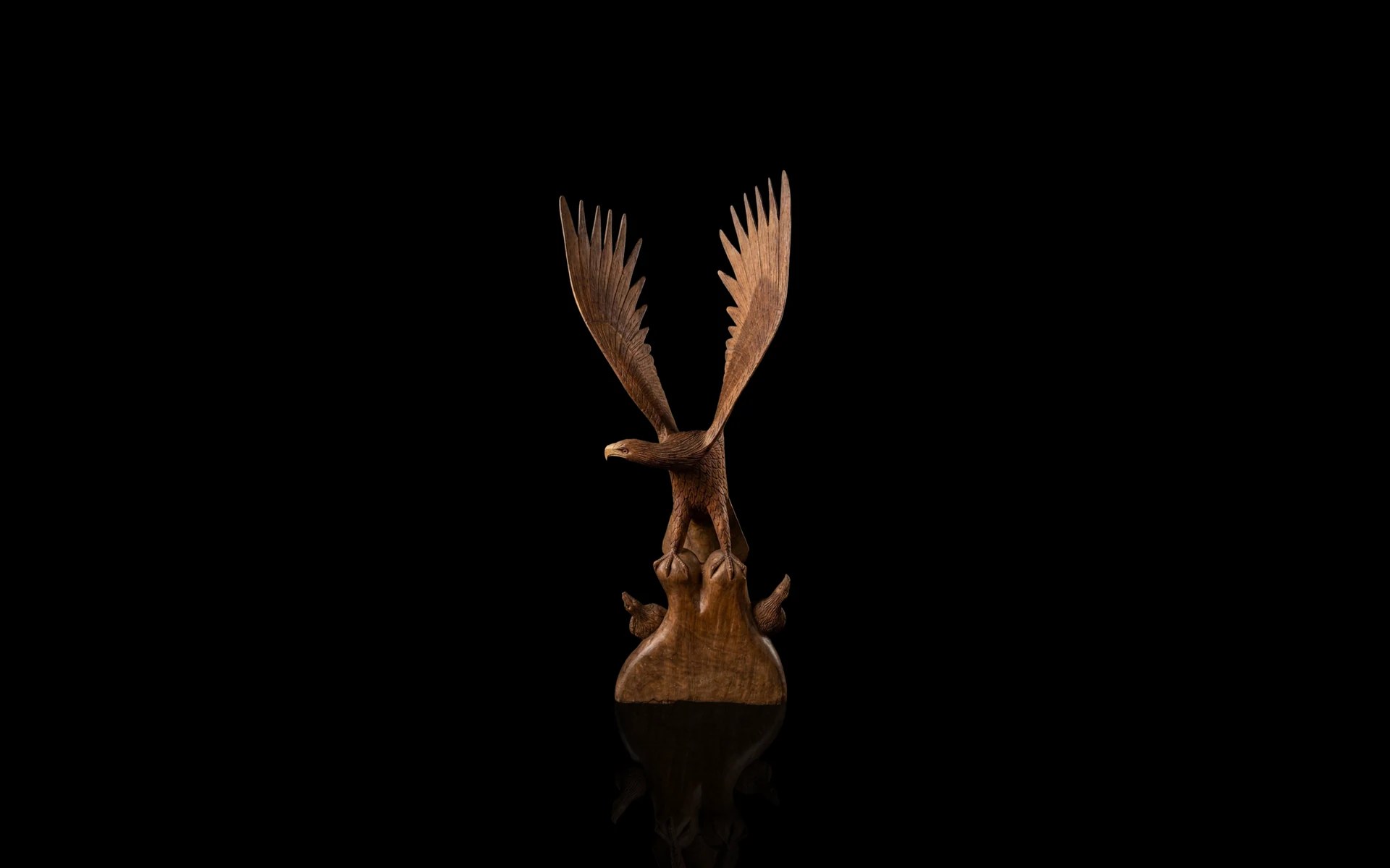 Hand-carved wooden eagle with spread wings